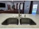 Modern kitchen sink with double basin and brushed nickel faucet at 437 Grand Reserve Dr, Davenport, FL 33837