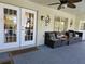 Relaxing patio with seating area and french doors at 437 Grand Reserve Dr, Davenport, FL 33837