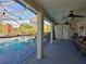 Screened pool and patio area with lounge chairs at 437 Grand Reserve Dr, Davenport, FL 33837