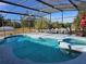 Inviting screened pool and spa with a spacious deck at 437 Grand Reserve Dr, Davenport, FL 33837