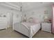 Bedroom with white bed frame, and pink bedding at 4451 Dinner Lake Blvd, Lake Wales, FL 33859