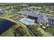 Community clubhouse with pool and surrounding landscape at 4505 Back Nine Dr, Winter Haven, FL 33884