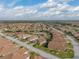 Bird's eye view of a house and neighborhood with lush greenery at 4505 Back Nine Dr, Winter Haven, FL 33884