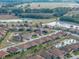 House nestled in a community near a pond, aerial view at 4505 Back Nine Dr, Winter Haven, FL 33884