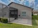 Home with screened lanai and patio, surrounded by lush landscaping at 4505 Back Nine Dr, Winter Haven, FL 33884
