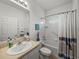 Clean bathroom with tub, shower curtain, and nautical theme at 4505 Back Nine Dr, Winter Haven, FL 33884