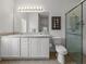 Bathroom with double vanity, large mirror, and walk-in shower at 4505 Back Nine Dr, Winter Haven, FL 33884