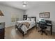 Bedroom with a queen bed, desk, and built-in shelving at 4505 Back Nine Dr, Winter Haven, FL 33884