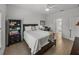 Bedroom with queen bed, dresser, and access to bathroom at 4505 Back Nine Dr, Winter Haven, FL 33884