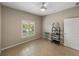 Spacious bedroom with tile floors, ceiling fan, and window with blinds at 4505 Back Nine Dr, Winter Haven, FL 33884