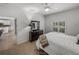 Bedroom with a queen bed, dresser, and view of kitchen at 4505 Back Nine Dr, Winter Haven, FL 33884