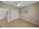 Simple bedroom with tile floors, double door closet, ceiling fan at 4505 Back Nine Dr, Winter Haven, FL 33884