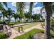 Bocce ball court with palm trees and lake views at 4505 Back Nine Dr, Winter Haven, FL 33884