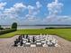 Giant chessboard overlooking a tranquil lake at 4505 Back Nine Dr, Winter Haven, FL 33884