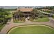 Two-story clubhouse with palm trees and paved driveway at 4505 Back Nine Dr, Winter Haven, FL 33884