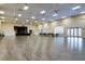 Large clubhouse community room with hardwood floors and a stage at 4505 Back Nine Dr, Winter Haven, FL 33884
