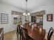 Bright dining room with table and chairs, offering view of patio at 4505 Back Nine Dr, Winter Haven, FL 33884