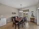 Dining room with large table and chairs, and access to screened patio at 4505 Back Nine Dr, Winter Haven, FL 33884