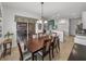 Bright dining room featuring a spacious table with six chairs, view to living room at 4505 Back Nine Dr, Winter Haven, FL 33884