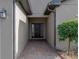 Inviting front entrance with a brick walkway leading to a black front door at 4505 Back Nine Dr, Winter Haven, FL 33884