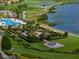 Landscaped gardens with chessboard and lake views at 4505 Back Nine Dr, Winter Haven, FL 33884