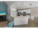 Kitchen features a breakfast bar, stainless steel appliances, and white cabinets at 4505 Back Nine Dr, Winter Haven, FL 33884