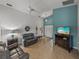 Comfortable living room featuring gray reclining sofas and a view into other rooms at 4505 Back Nine Dr, Winter Haven, FL 33884