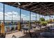 Outdoor patio area with tables and chairs, overlooking the pool at 4505 Back Nine Dr, Winter Haven, FL 33884