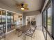 Relaxing screened lanai with patio furniture and views of the house and golf course at 4505 Back Nine Dr, Winter Haven, FL 33884