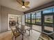 Screened patio with view of backyard and dining room, includes table and seating at 4505 Back Nine Dr, Winter Haven, FL 33884