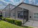 Screened patio with exterior view of the house at 4505 Back Nine Dr, Winter Haven, FL 33884
