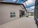Screened patio with tiled floor and access to the house at 4505 Back Nine Dr, Winter Haven, FL 33884