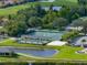 Tennis and shuffleboard courts with covered seating at 4505 Back Nine Dr, Winter Haven, FL 33884