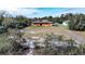 Aerial view of fire damaged house and surrounding area at 517 Cipres Cir, Winter Haven, FL 33880