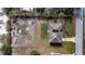 Aerial view of a fire-damaged house and surrounding lot at 517 Cipres Cir, Winter Haven, FL 33880