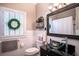 Clean bathroom with white subway tile, glass sink and window shutters at 524 Arneson Ave, Auburndale, FL 33823
