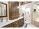 Elegant bathroom with double vanity and walk-in shower at 524 Arneson Ave, Auburndale, FL 33823
