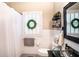 Clean bathroom with white subway tile, glass sink and window shutters at 524 Arneson Ave, Auburndale, FL 33823
