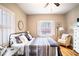 Spacious bedroom with hardwood floors, window shutters and a ceiling fan at 524 Arneson Ave, Auburndale, FL 33823
