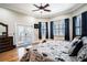Main bedroom with access to a deck and hardwood floors at 524 Arneson Ave, Auburndale, FL 33823