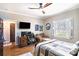 Bedroom with home office space, hardwood floors, and large window at 524 Arneson Ave, Auburndale, FL 33823