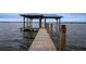 Long wooden dock on the lake at 524 Arneson Ave, Auburndale, FL 33823