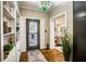 Elegant entryway with built-in shelving, hardwood floors and stained glass light at 524 Arneson Ave, Auburndale, FL 33823