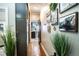 Hallway with hardwood floors and artwork on the walls at 524 Arneson Ave, Auburndale, FL 33823