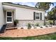 Well-maintained exterior with stone accents and walkway at 524 Arneson Ave, Auburndale, FL 33823