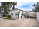 Charming house exterior with carport and landscaping at 524 Arneson Ave, Auburndale, FL 33823