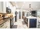 Spacious kitchen featuring granite countertops and stainless steel appliances at 524 Arneson Ave, Auburndale, FL 33823