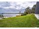 Expansive grassy yard with lake access and dock at 524 Arneson Ave, Auburndale, FL 33823
