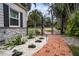 Brick pathway and wrought iron gates enhance curb appeal at 524 Arneson Ave, Auburndale, FL 33823