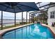 Relaxing screened-in pool with lake view at 524 Arneson Ave, Auburndale, FL 33823